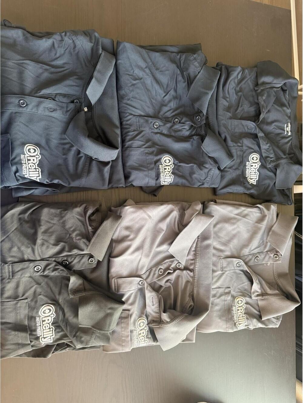 Lot of 6 2XL O’Reilly Polos- 3 Navy, 2 Gray, 1 Black